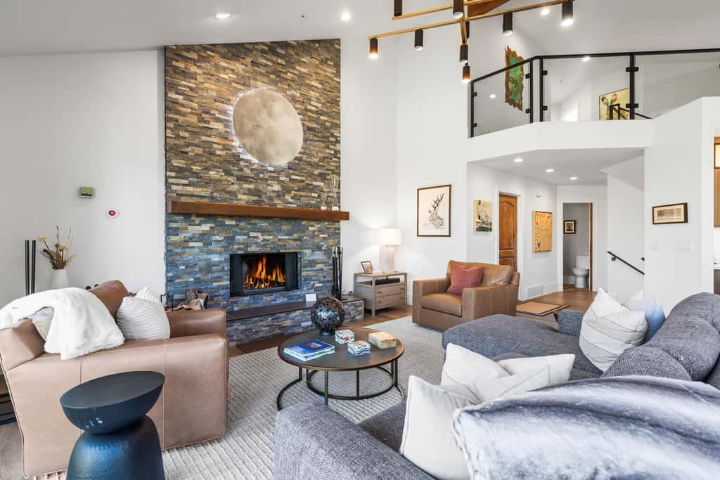 Mountain-view abode with a hot tub, scenic balcony, fireplaces, & free shuttle