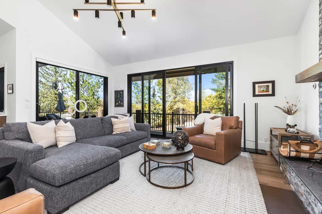 Mountain-view abode with a hot tub, scenic balcony, fireplaces, & free shuttle