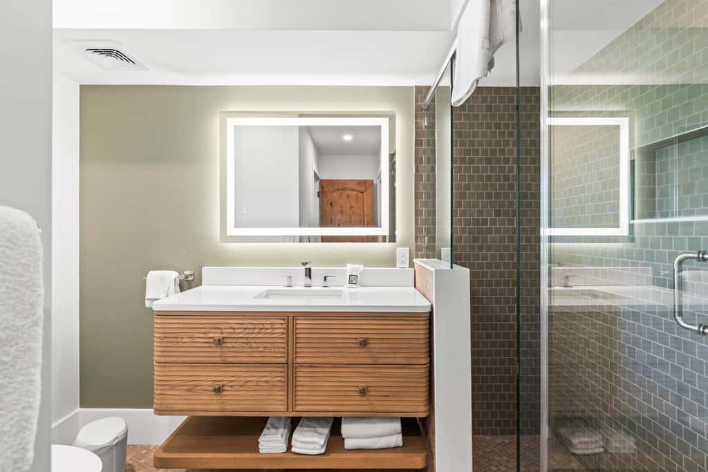 Mountain-view abode with a hot tub, scenic balcony, fireplaces, & free shuttle