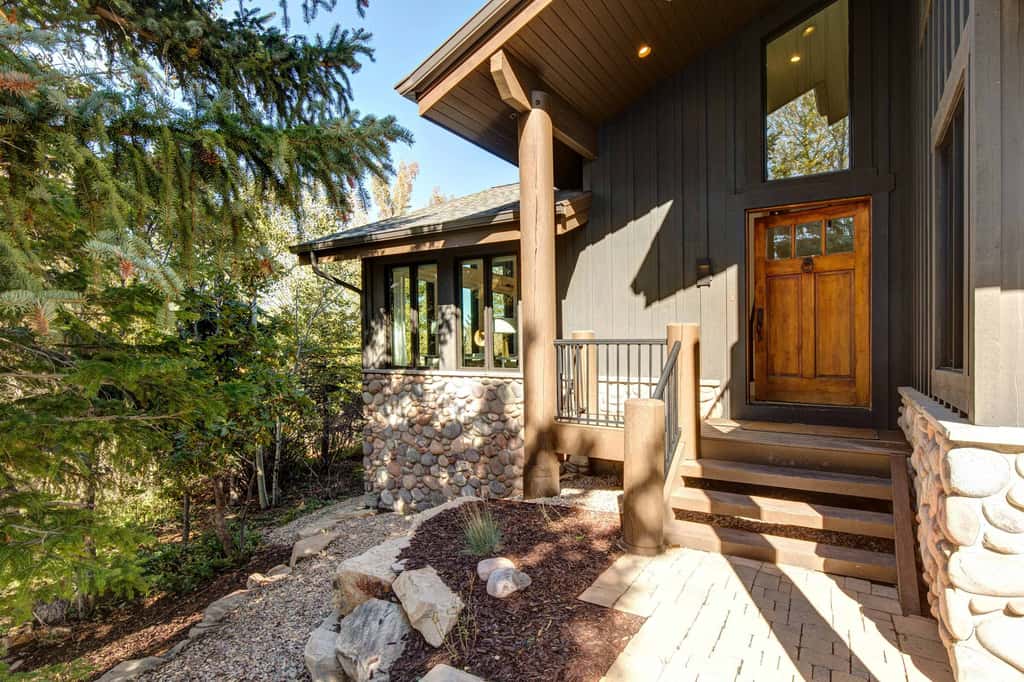 Mountain-view abode with a hot tub, scenic balcony, fireplaces, & free shuttle