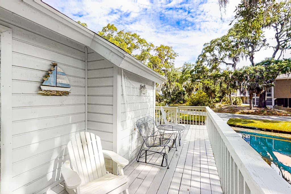 Updated, dog-friendly home with grill, W/D, screened porch, & central AC
