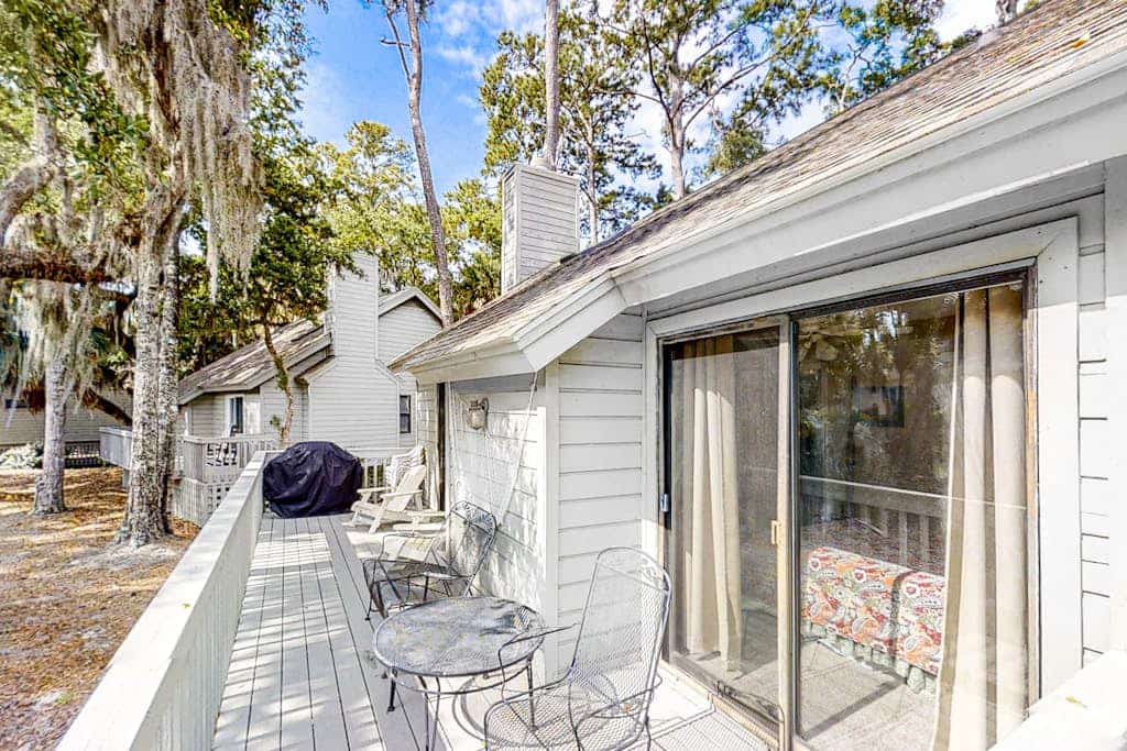 Updated, dog-friendly home with grill, W/D, screened porch, & central AC
