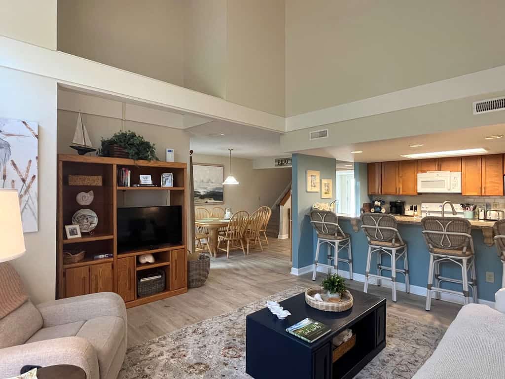 Coastal townhome with riverfront views, deck, & W/D - pool and athletic courts