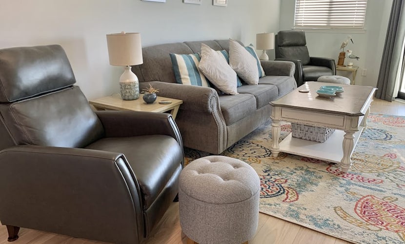 Inviting waterfront condo with marsh view, shared pool, balcony & central AC