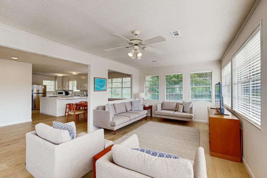 Beach home with huge lawn, open deck, covered patio & grill