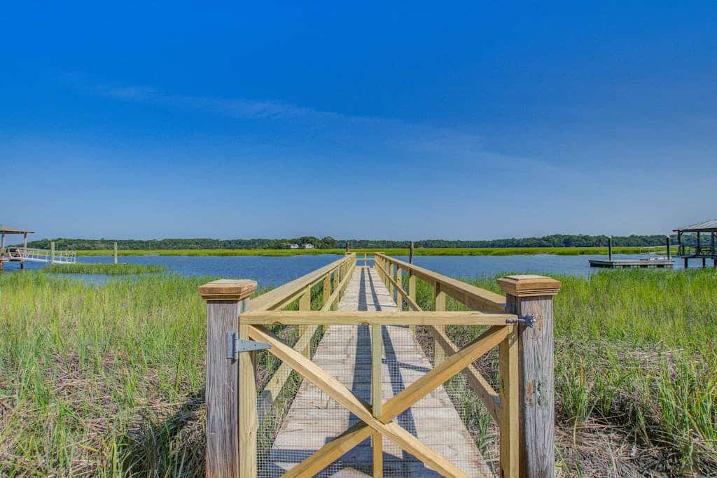 Waterfront home with private dock & deck with great views, walk to the beach