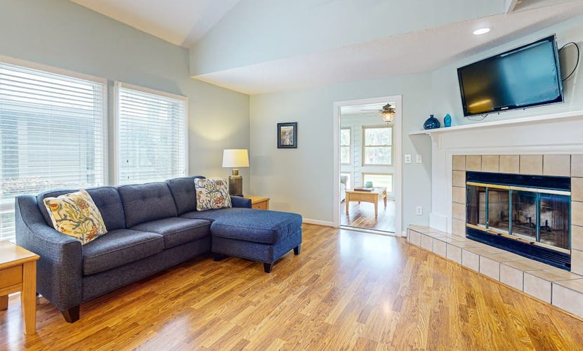 Golf course-front condo with screened sunroom & minutes from beach