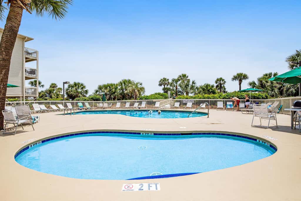 Beach-view condo in oceanfront complex with outdoor pool, beach access, balcony