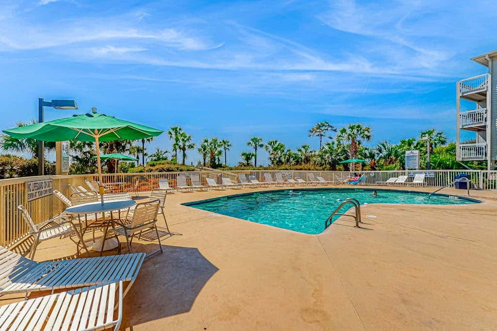 Condo with Coligny Beach views, outdoor pool, beach access, balcony, WD, & AC