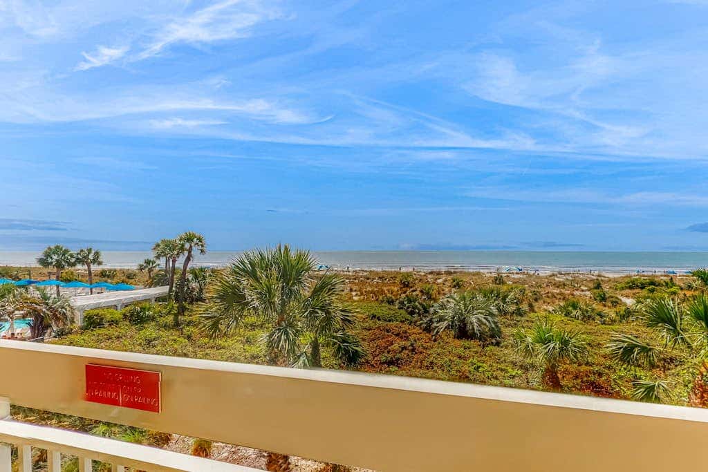 Condo with Coligny Beach views, outdoor pool, beach access, balcony, WD, & AC