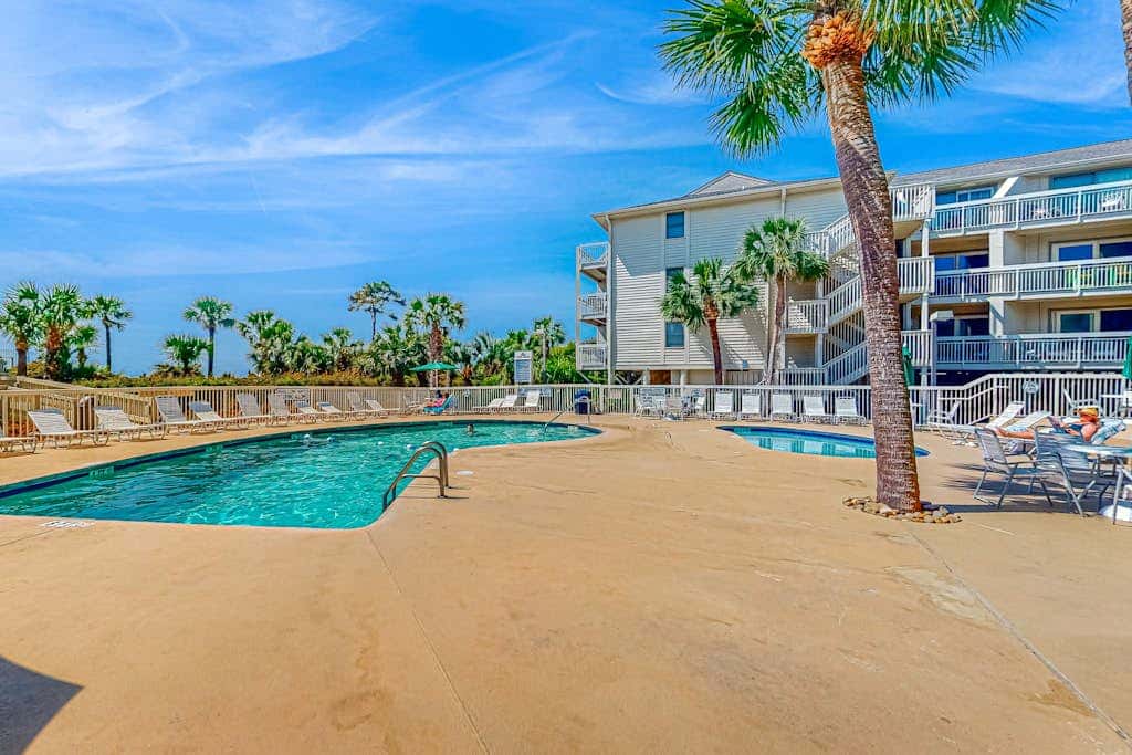 Condo with Coligny Beach views, outdoor pool, beach access, balcony, WD, & AC