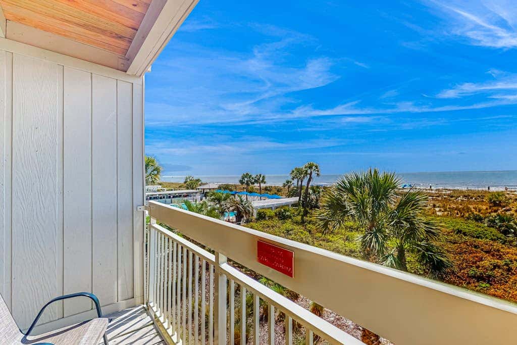 Condo with Coligny Beach views, outdoor pool, beach access, balcony, WD, & AC