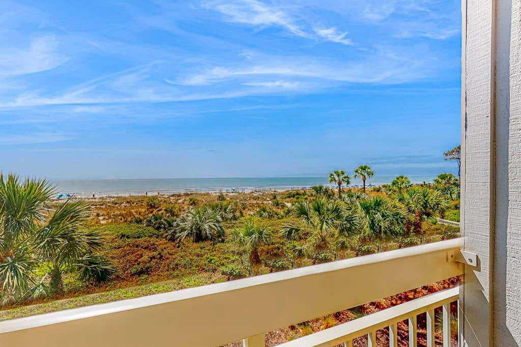 Condo with Coligny Beach views, outdoor pool, beach access, balcony, WD, & AC