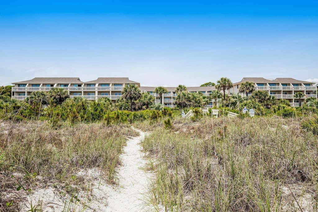 Condo with Coligny Beach views, outdoor pool, beach access, balcony, WD, & AC