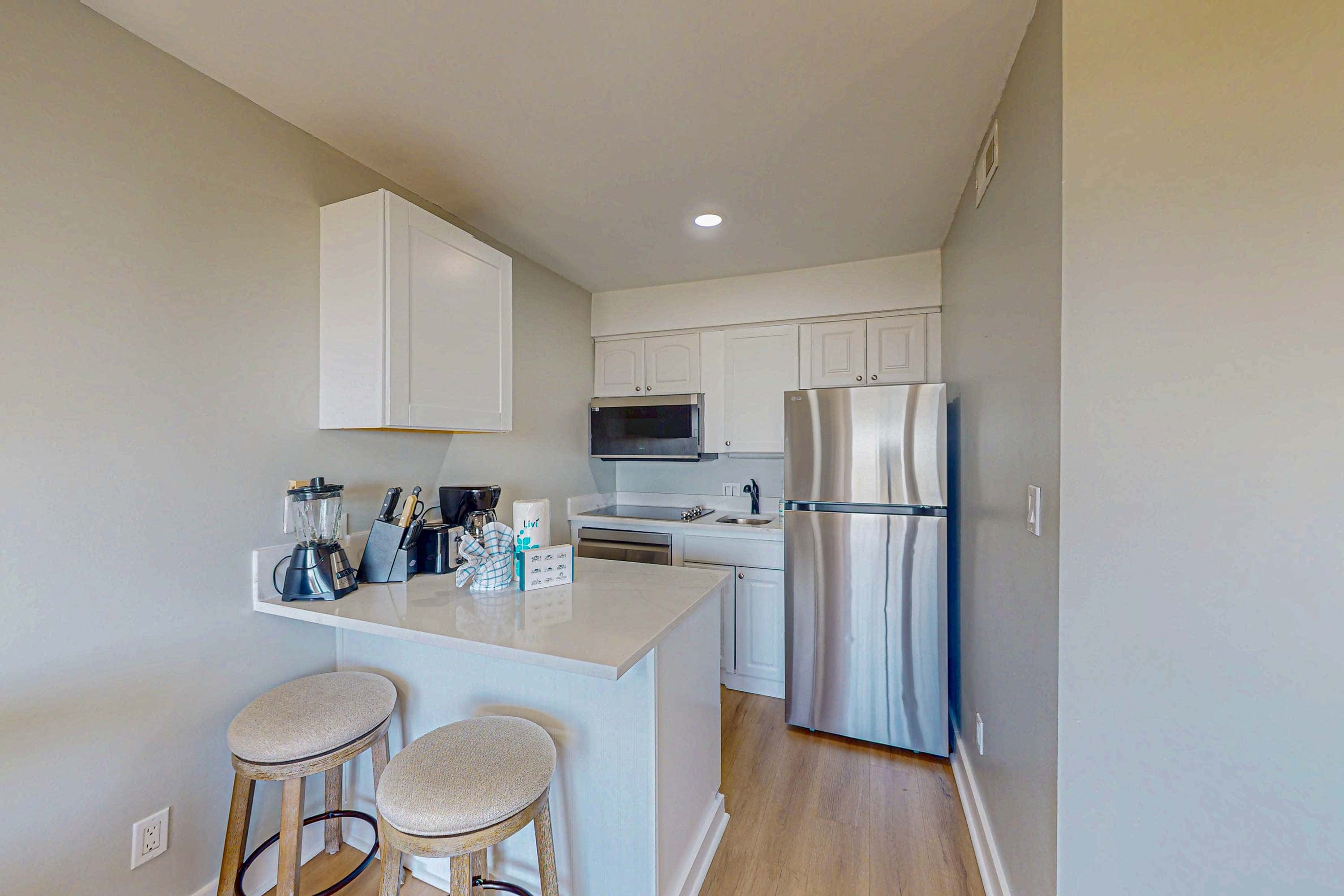 Condo with Coligny Beach views, outdoor pool, beach access, balcony, WD, & AC