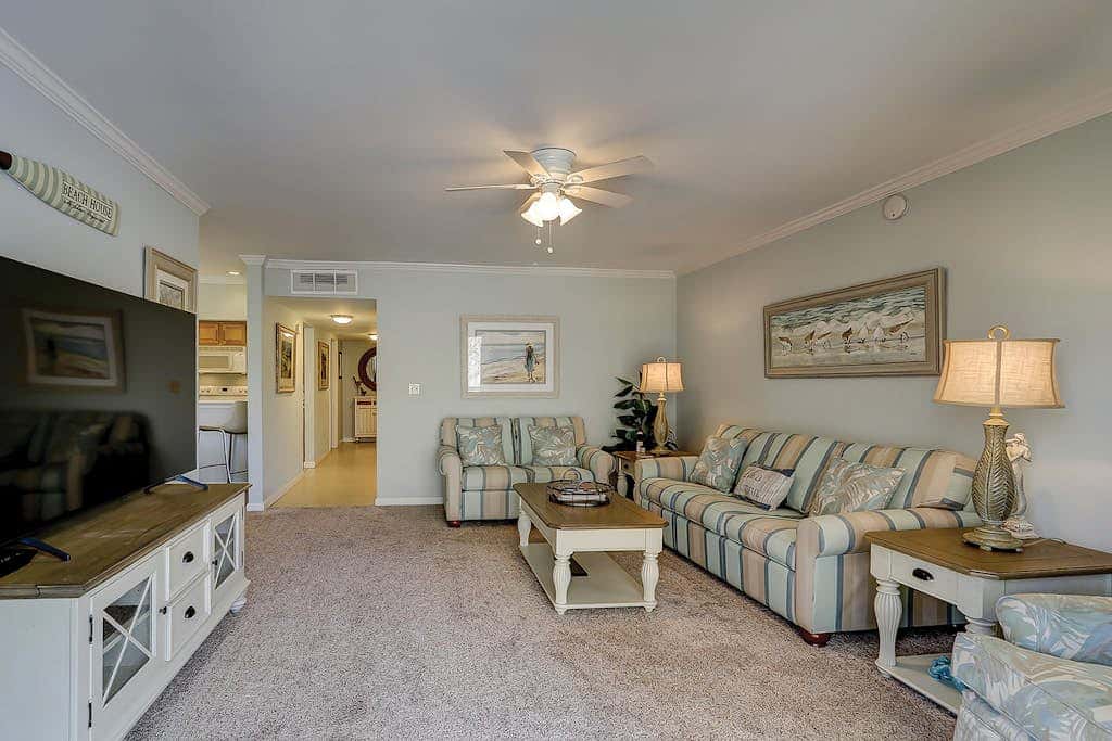 Waterfront condo with seasonal pools, hot tub, balcony, AC, & WD