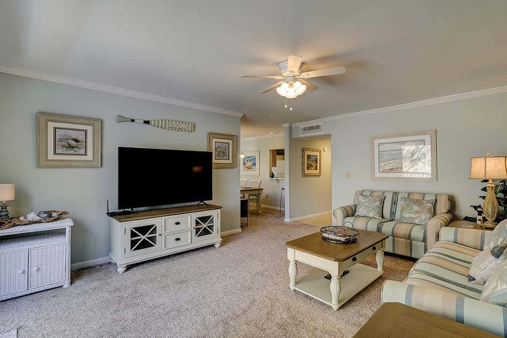 Waterfront condo with seasonal pools, hot tub, balcony, AC, & WD