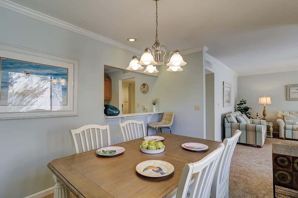 Waterfront condo with seasonal pools, hot tub, balcony, AC, & WD