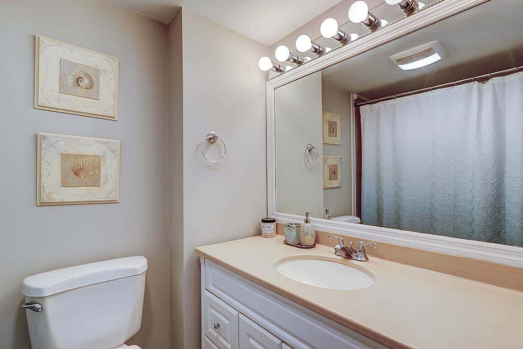 Waterfront condo with seasonal pools, hot tub, balcony, AC, & WD