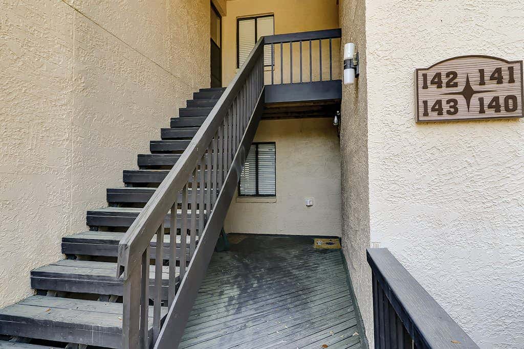Waterfront condo with seasonal pools, hot tub, balcony, AC, & WD