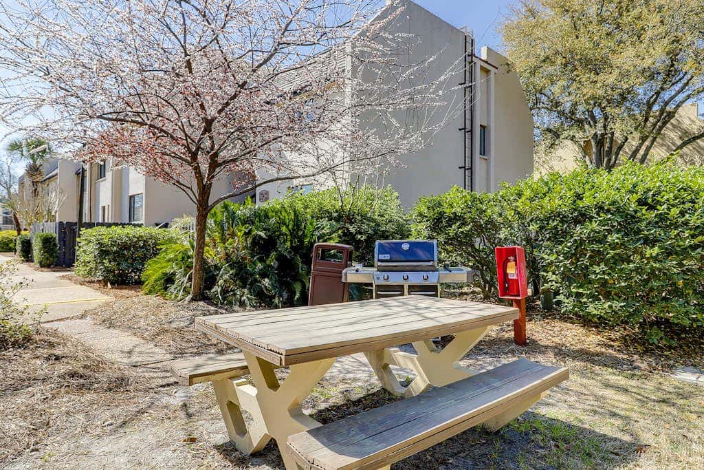 Waterfront condo with seasonal pools, hot tub, balcony, AC, & WD