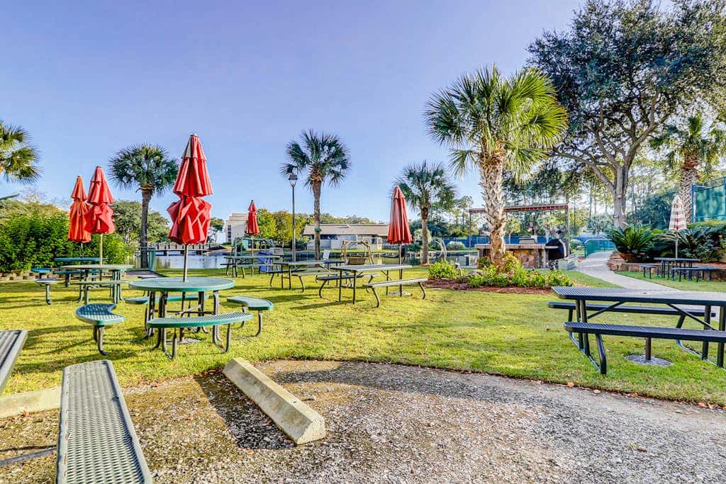 Waterfront condo with seasonal pools, hot tub, balcony, AC, & WD
