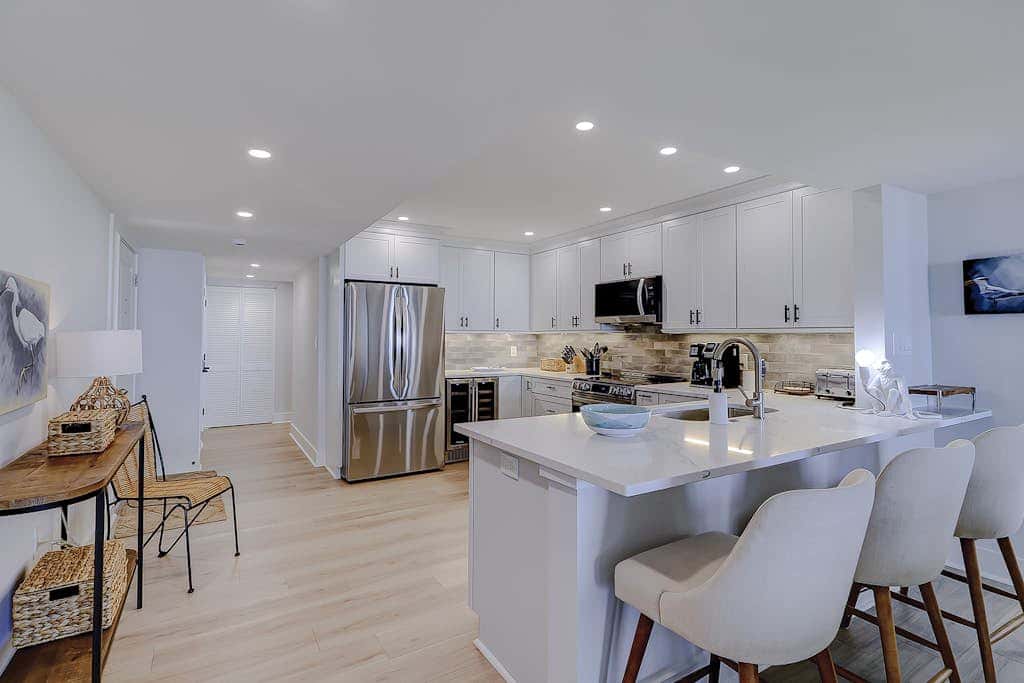 Beachfront escape with pools, hot tub, athletic courts, WD, and central AC