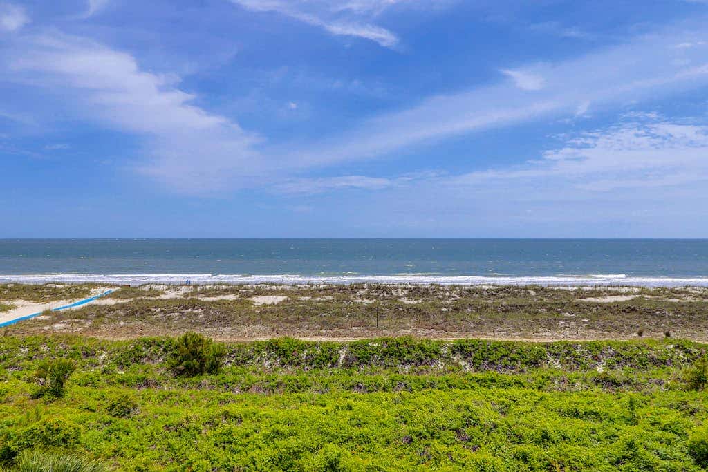 Beachfront escape with pools, hot tub, athletic courts, WD, and central AC