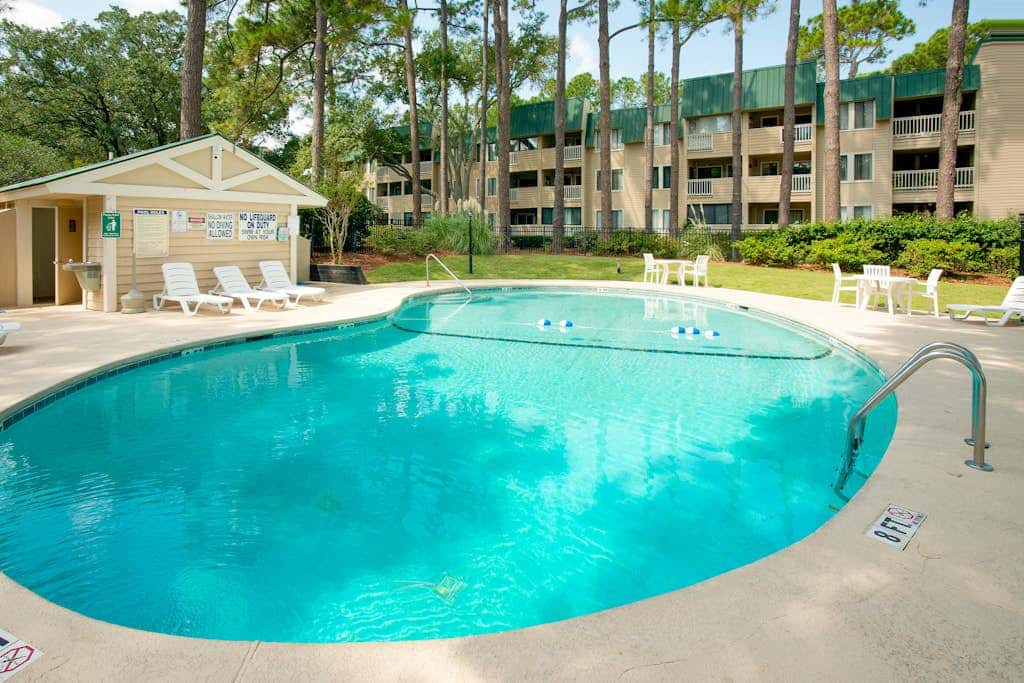 3rd-floor condo with water views, balcony, pools, gym, & beach access