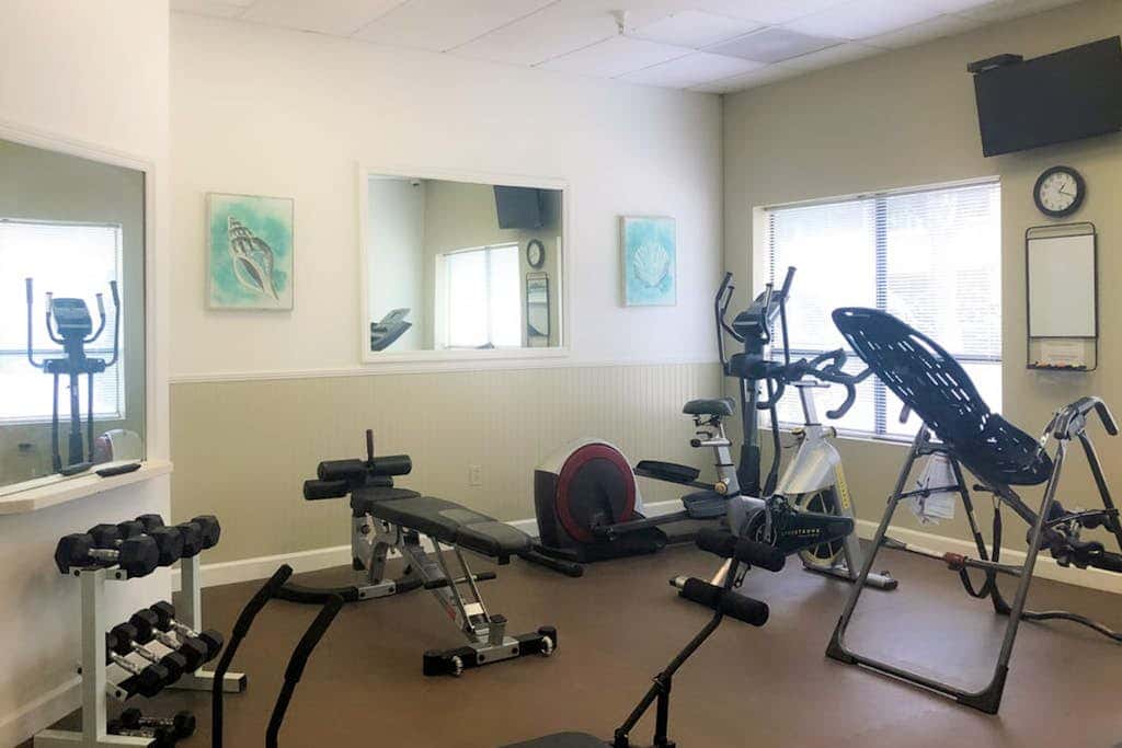 3rd-floor condo with water views, balcony, pools, gym, & beach access