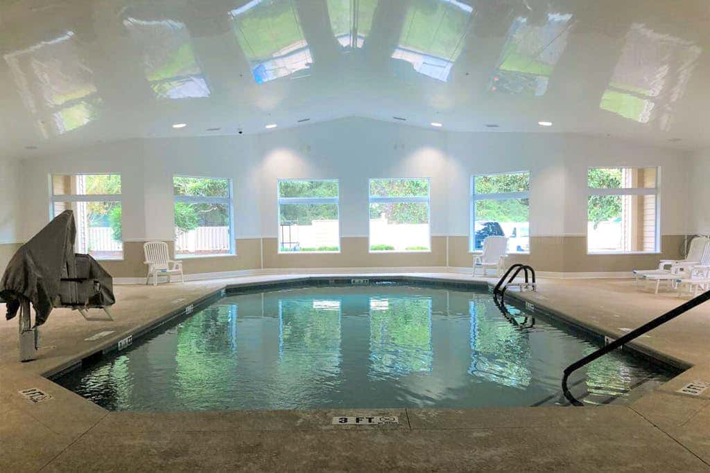 3rd-floor condo with water views, balcony, pools, gym, & beach access