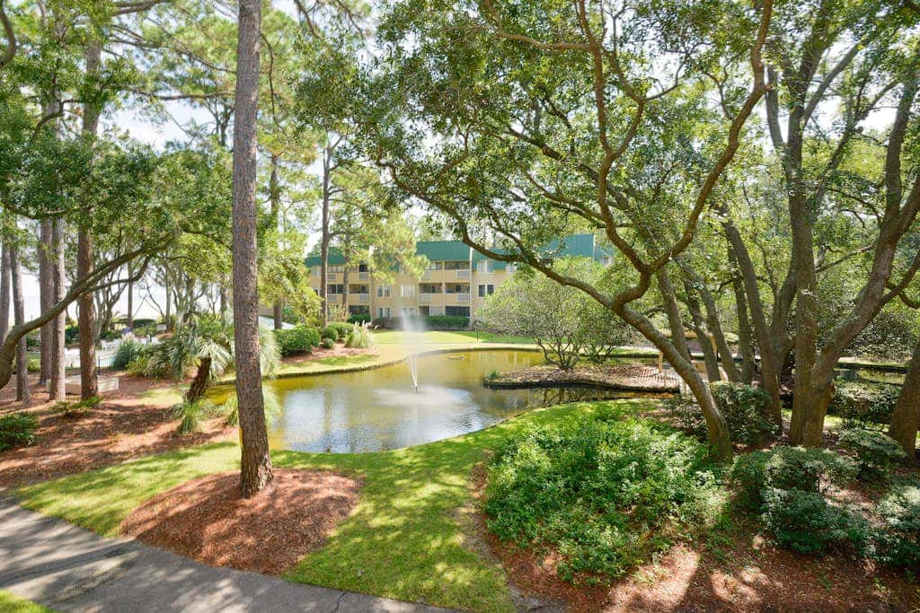 3rd-floor condo with water views, balcony, pools, gym, & beach access