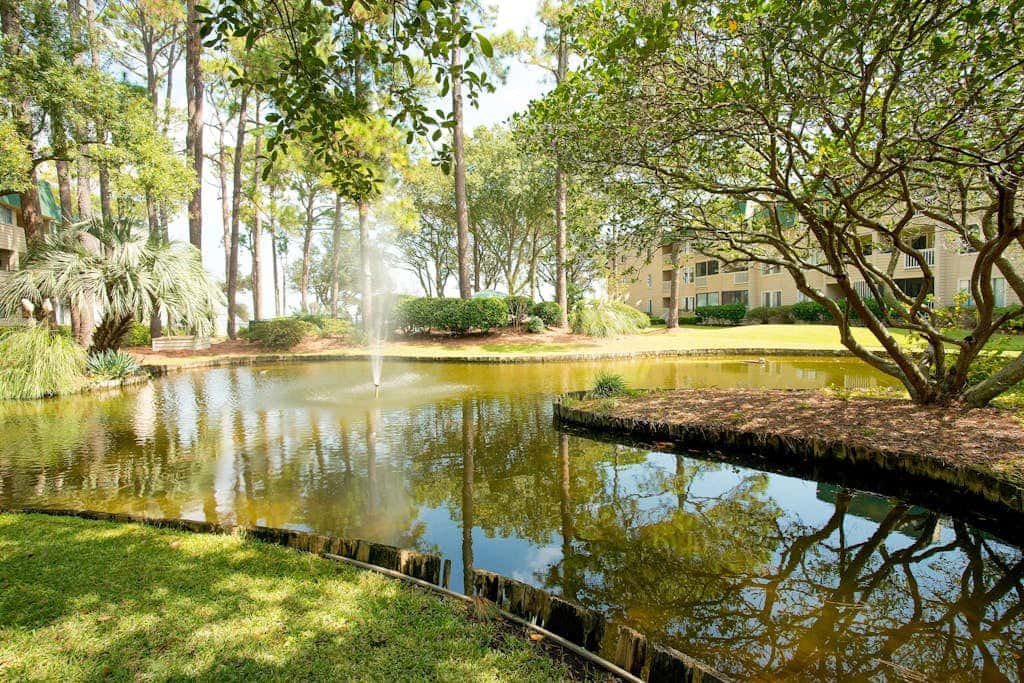3rd-floor condo with water views, balcony, pools, gym, & beach access