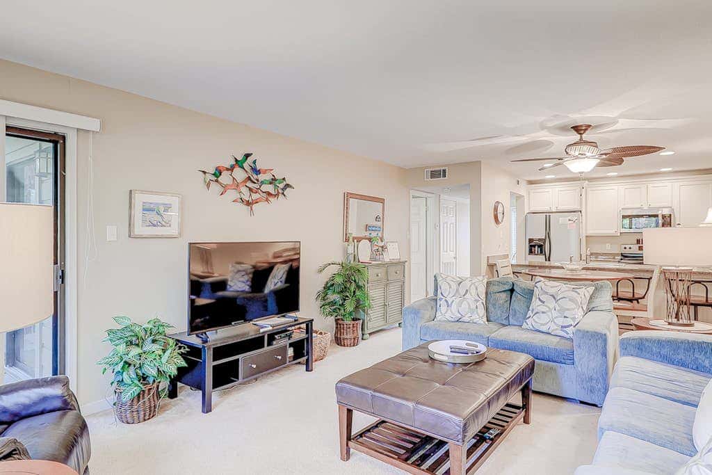 Dog friendly condo with pool, central AC, & washer and dryer, quick walk to beach
