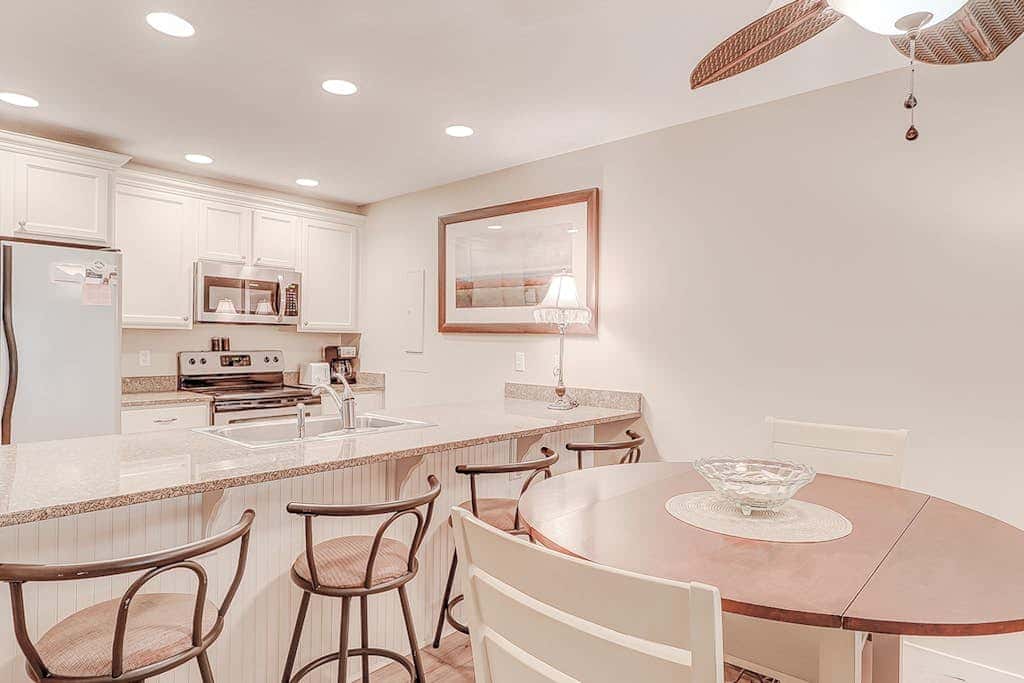 Dog friendly condo with pool, central AC, & washer and dryer, quick walk to beach