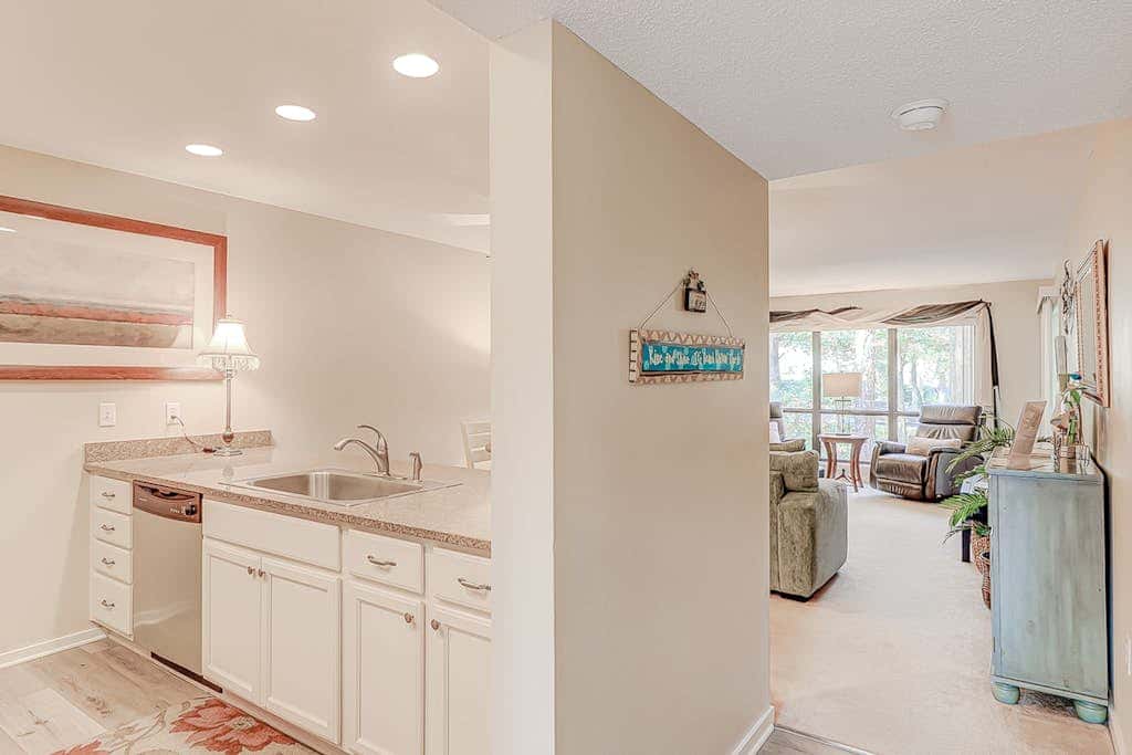 Dog friendly condo with pool, central AC, & washer and dryer, quick walk to beach