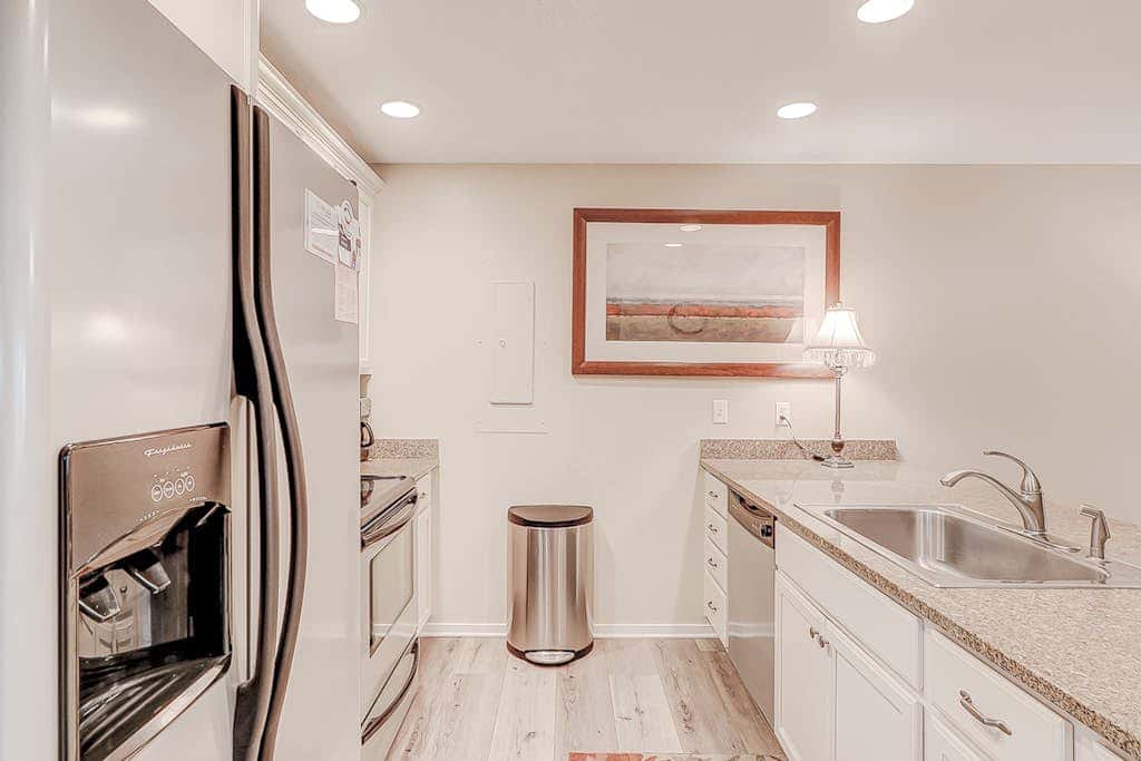 Dog friendly condo with pool, central AC, & washer and dryer, quick walk to beach
