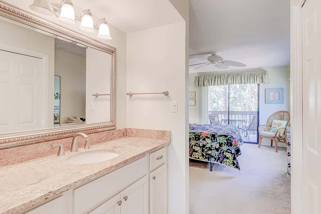 Dog friendly condo with pool, central AC, & washer and dryer, quick walk to beach