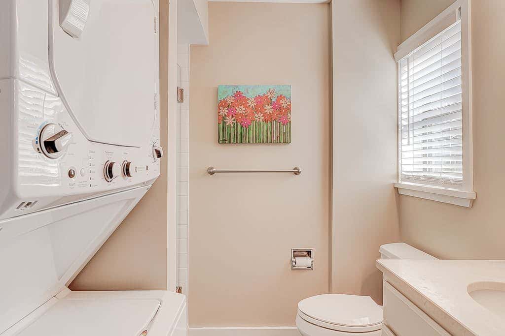 Dog friendly condo with pool, central AC, & washer and dryer, quick walk to beach