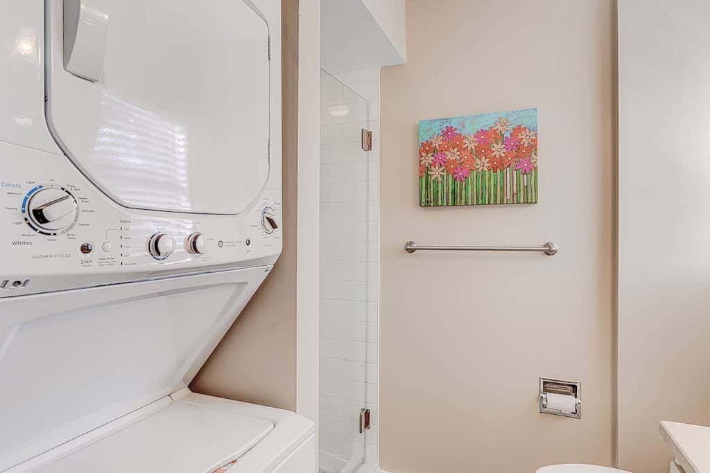 Dog friendly condo with pool, central AC, & washer and dryer, quick walk to beach
