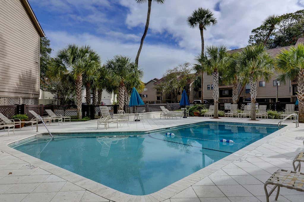 Dog friendly condo with pool, central AC, & washer and dryer, quick walk to beach