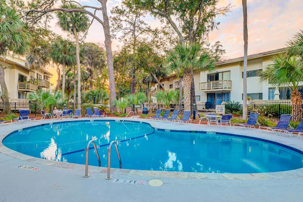Beach access condo with deck, pool, washer dryer, and AC - snowbird-friendly