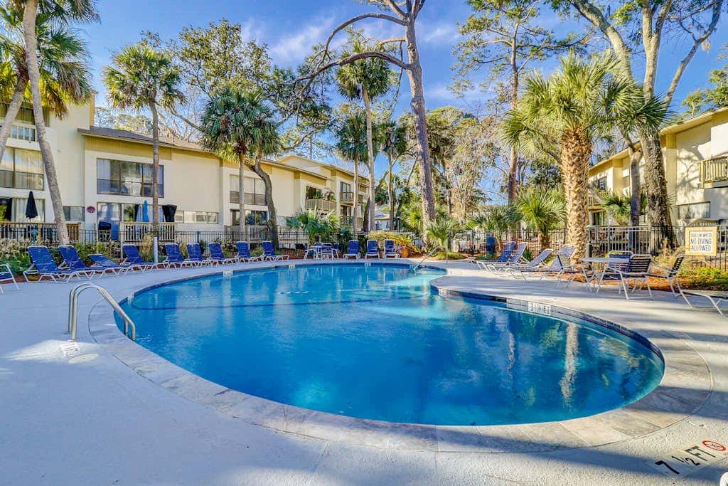 Beach access condo with deck, pool, washer dryer, and AC - snowbird-friendly