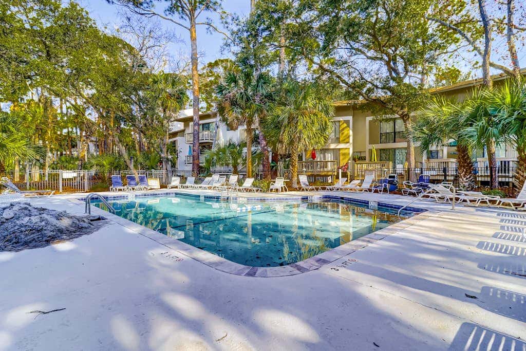 Beach access condo with deck, pool, washer dryer, and AC - snowbird-friendly