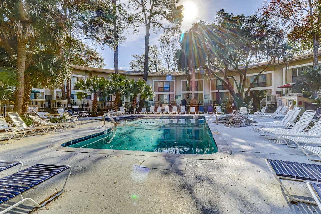 Beach access condo with deck, pool, washer dryer, and AC - snowbird-friendly