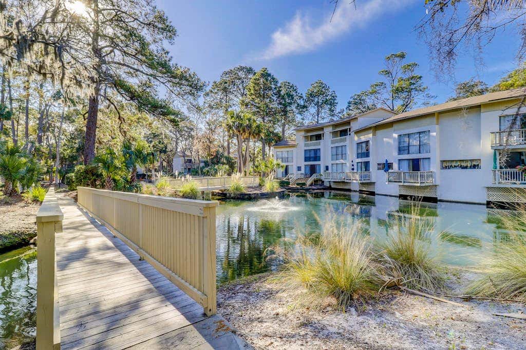 Beach access condo with deck, pool, washer dryer, and AC - snowbird-friendly