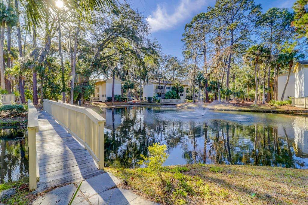 Beach access condo with deck, pool, washer dryer, and AC - snowbird-friendly