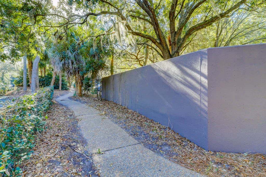 Beach access condo with deck, pool, washer dryer, and AC - snowbird-friendly