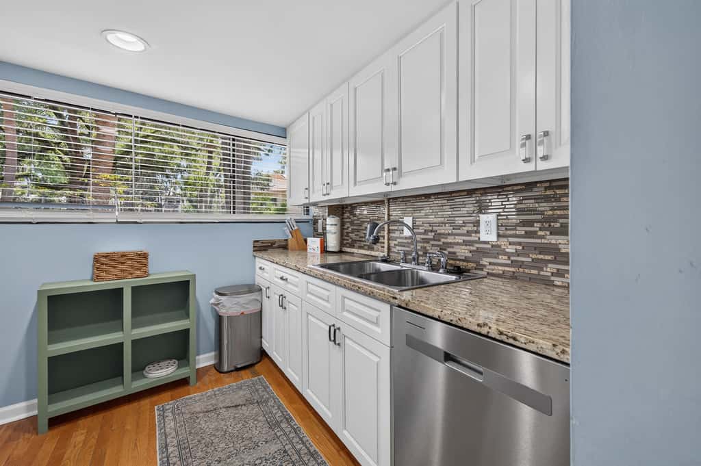 Beach access condo with deck, pool, washer dryer, and AC - snowbird-friendly