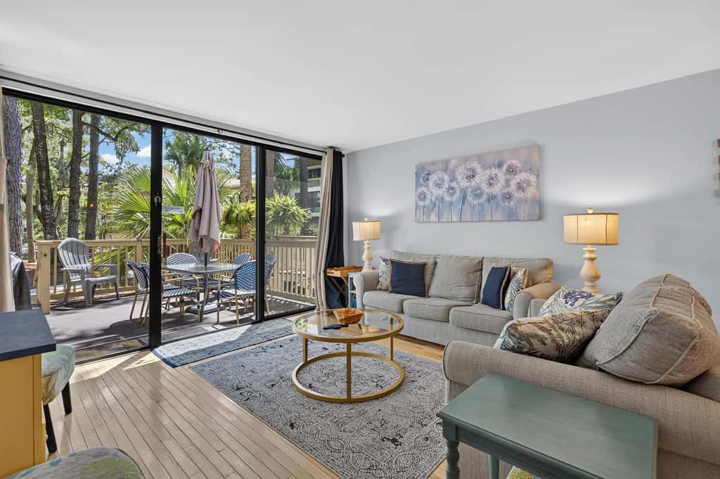 Beach access condo with deck, pool, washer dryer, and AC - snowbird-friendly